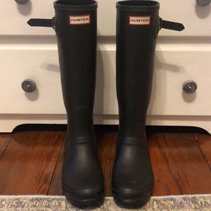 Black tall hunter boots